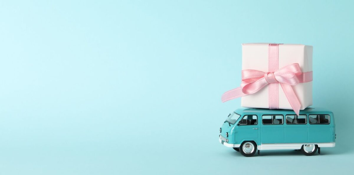 Image of a gift on top of a bus representing getting the right people on "your bus". nonprofit talent management