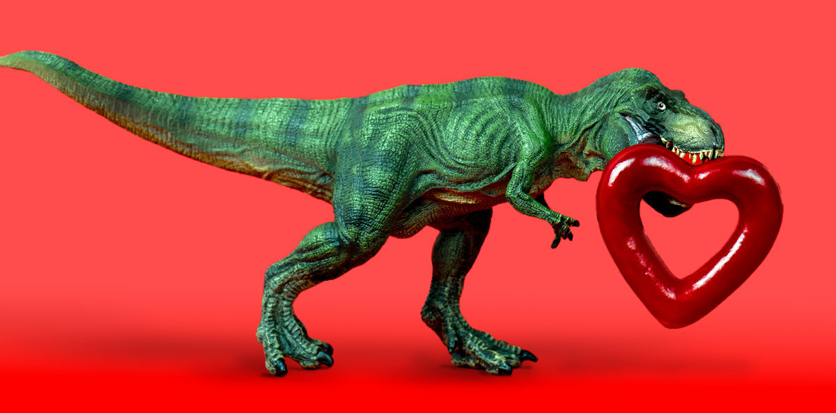 founder's syndrome - a green plastic T-rex walking across a red background with a shiny red heart that has a hollow center carried in its mouth