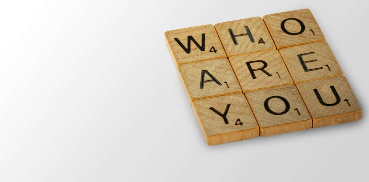 scrabble tiles in a three by three box that reads "Who are you" mean to invoke empathetic leadership.