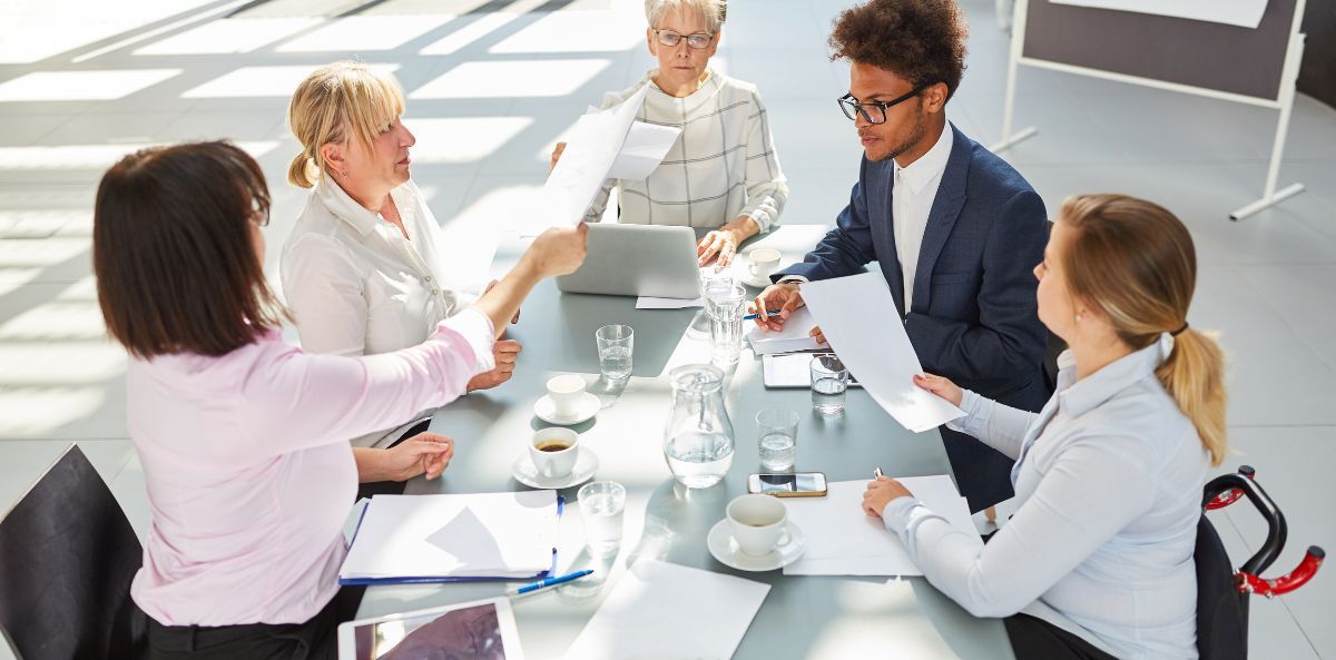 business meeting of five people