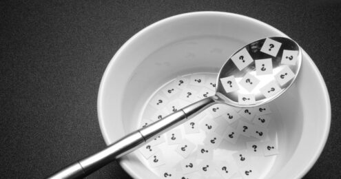 A bowl full of question marks on tiny slips of paper, signifying the hidden ingredient of a high functioning board.